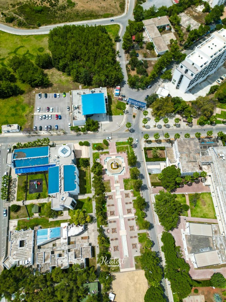 Aerial shot of urban layout in Gemikonağı with roads and rooftops visible.